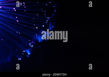 A captivating display of abstract neon lamp lights featuring glowing smudges against a dark background. The vibrant colors and dynamic light patterns Stock Photo