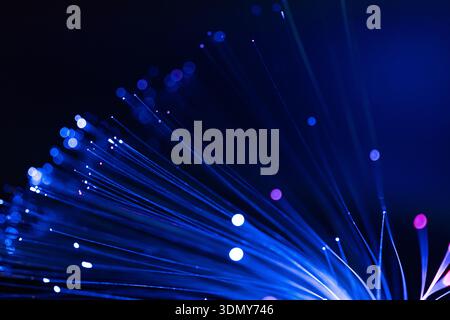 A captivating abstract image featuring a burst of neon light with a mesmerizing bokeh effect. The vibrant colors and radiant smudges create a dynamic Stock Photo