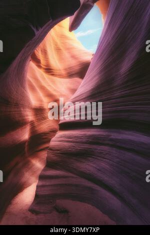 Stunning view of Antelope Canyon in the USA, showcasing its smooth, swirling rock formations. Natural light enhances the vibrant colors and textures, Stock Photo