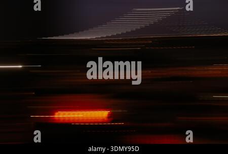 A captivating display of abstract light streaks against a dark background, capturing the essence of motion and speed with vibrant colors. Perfect for Stock Photo