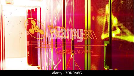 Displaying row of server racks flashing RED ALERT overlay in data center aisle, with LED lights Stock Photo