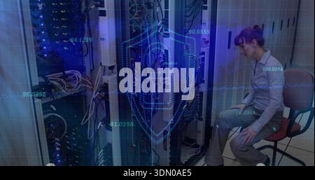 Inspecting tech in light shirt gray slacks leaning into server racks with LEDs, overlay, copy space Stock Photo
