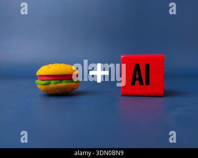 Small toy hamburger with a red block labeled AI. Stock Photo
