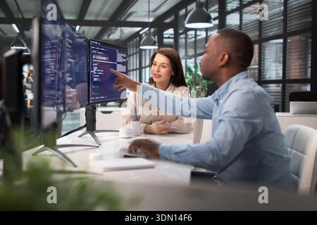 The African American Man Is An Agile Software Engineer. Stock Photo