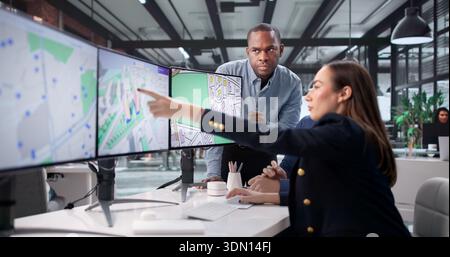 Real Estate Team Mapping Urban Projects Using GIS Software: Valuation Stock Photo