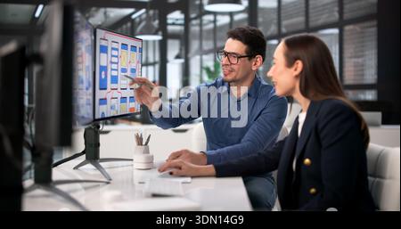Design Team Using Computers For UI/UX Development In Webinar Training. Stock Photo