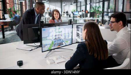 Engineers On GIS Team Using Design Software For Mapping Land. Stock Photo