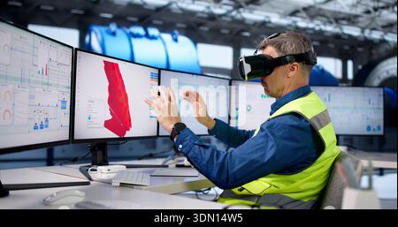 Engineer Designs Gas Refinery With AR And Virtual Reality Glasses. Stock Photo