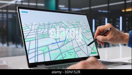 Man Searching For Property Locations On Laptop Using GPS Locator. Stock Photo