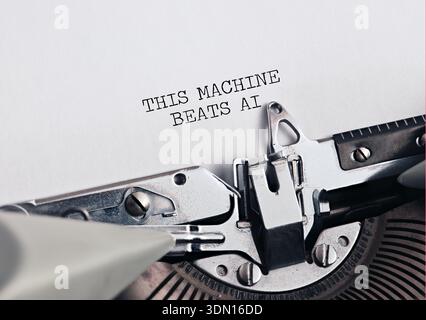 Typewriter typing THIS MACHINE BEATS AI on paper, symbolizing human creativity versus artificial intelligence or tradition versus progress. Stock Photo
