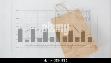 Lying kraft bag with twisted handles overlaying gray bar and line chart on sheet showing values Stock Photo
