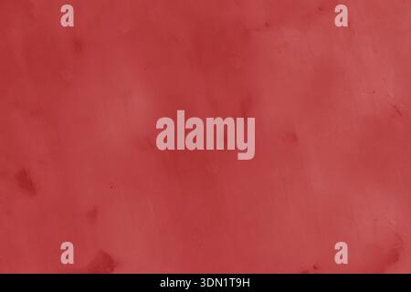 Old abandoned, damaged wall as a background. Red old, worn plaster. Stock Photo