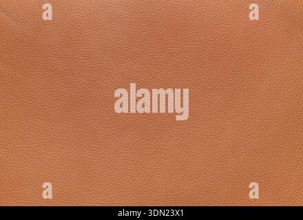 Genuine orange brown natural leather texture background. Stock Photo
