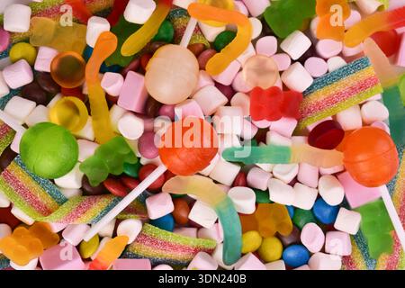 Lots of flat lay candies. Background of candies. Stock Photo