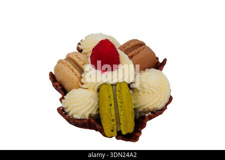 Tartlet with macaroons, whipped cream and raspberry isolated on white background Stock Photo