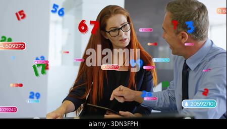 Discussing coworkers in business clothes pointing at tablet in office, with AR badges and glasses Stock Photo