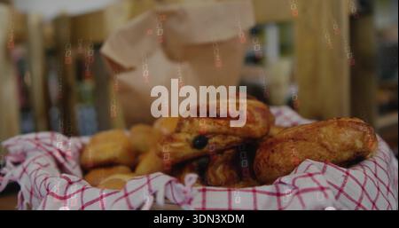 Displaying woven basket holding golden pastries on bakery counter with checked towel and paper bag Stock Photo