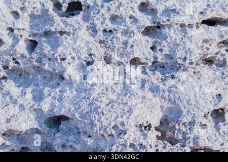 Natural stone surface texture, architectural background, macro shot solid rock material, gray mineral slab with rough grain organic pattern details Stock Photo