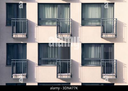 Modern residential building facade with repeating window patterns in Bratislava, Slovakia. Contemporary urban architecture in the Slovak capital. Stock Photo