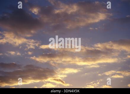 Stratocumulus clouds in the evening, with sunlight Stock Photo