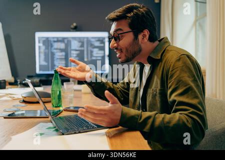 Professionals Exchanging Ideas About Programming And System Design In Modern Office Setting Stock Photo