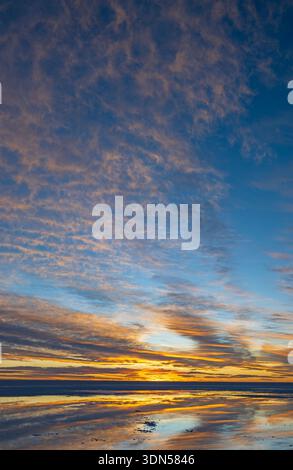 High Skies Over the Sat Flats at Sunset in Salar de Uyuni in Bolvia Stock Photo