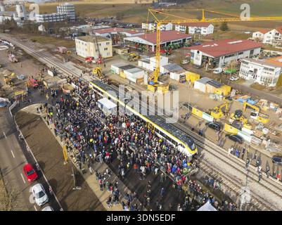 People gather around a train on a construction site, aerial view with landscape in the background, opening of the Hermann Hesse Railway, Calw, Germany Stock Photo