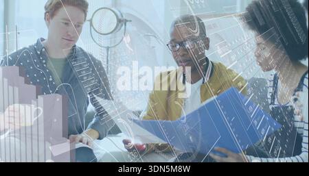 Reviewing three-person team in casual wear leaning over blue folder in office viewing data overlays Stock Photo