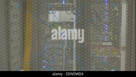 Displaying centered rack behind perforated door in server room, with patch cables and LEDs Stock Photo
