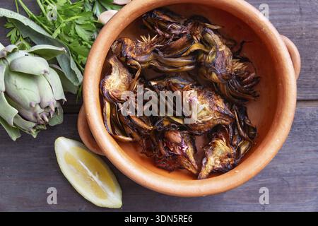 Plate of artichokes in hell on a rustic background Stock Photo