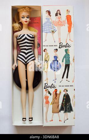 The original 1959 Barbie doll, the "Teen-Age Fashion Model," in its iconic  black-and-white striped swimsuit and original packaging Stock Photo - Alamy