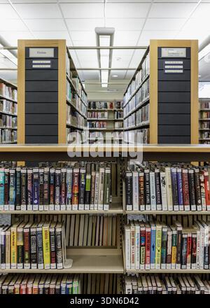 Interior view of the Leonia Public Library in New Jersey, featuring study tables, bookshelves, and modern lighting. Stock Photo