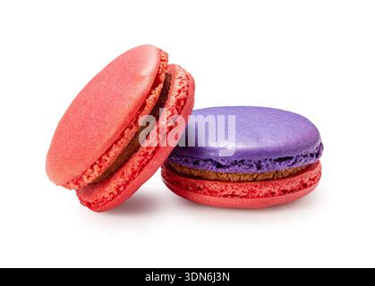 Two colorful macarons, pink and purple, leaning against each other, isolated on white background Stock Photo