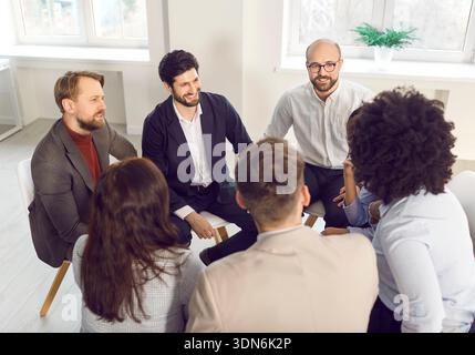 Business office, successful group of multiethnic employees brainstorming, team training  Stock Photo