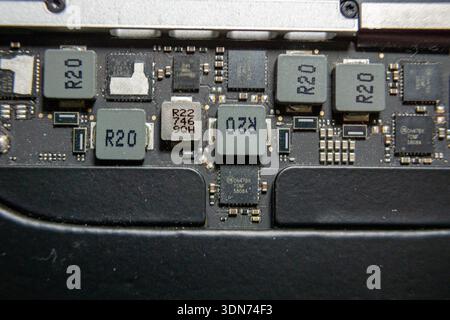 Close-up view of electronic components and power elements on a motherboard. Stock Photo