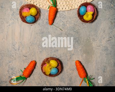 Easter bonnet straw hat decorated with eggs and flowers Stock Photo