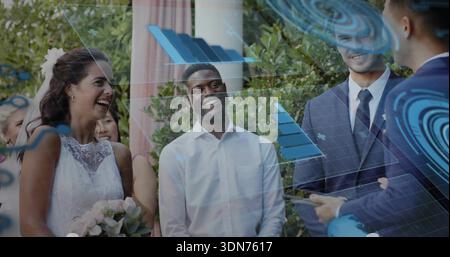 Laughing bride in wedding dress and partner standing at garden holding bouquet, veil, HUD overlays Stock Photo
