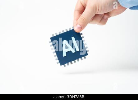 AI chip in hand. Computer Microchip with Artificial Intelligence. Advanced semiconductor symbolizes innovation. High tech hardware powers data, automa Stock Photo