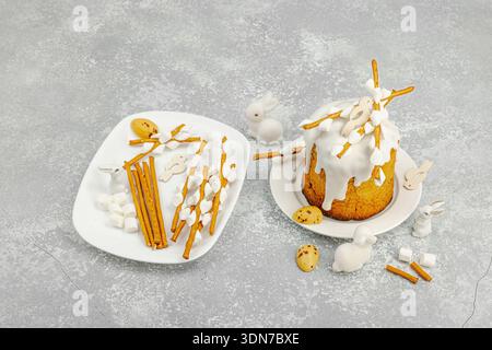 DIY process of making edible willow branches for Easter cake decoration using breadsticks and marshmallows. Holiday baking ingredients, quail eggs and Stock Photo