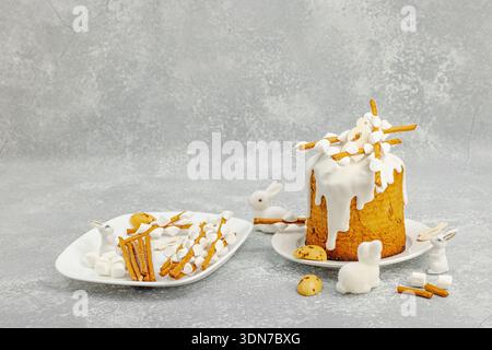 DIY process of making edible willow branches for Easter cake decoration using breadsticks and marshmallows. Holiday baking ingredients, quail eggs and Stock Photo