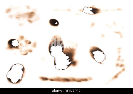 Burnt Holes of Paper and Marks Isolated on White Background Stock Photo