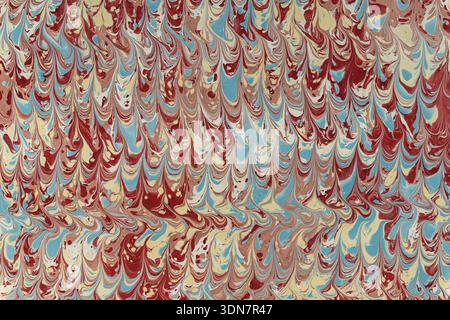 Marbled paper pattern showing colorful fluid texture and abstract artistic design Stock Photo