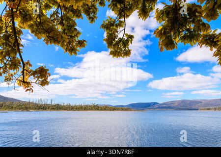 Lake Wartook reservoir landscape with rolling hills and dramatic clouds ...