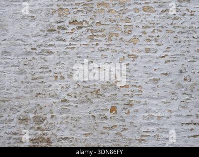 Weathered wall surface showing age and texture. Stock Photo
