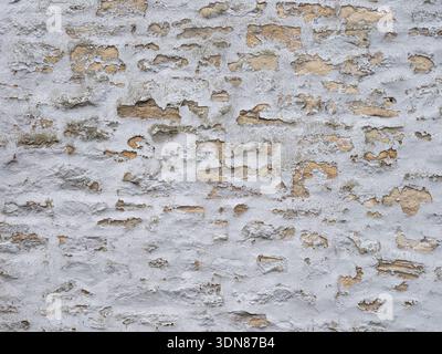 Vintage limewashed masonry close up For textured backdrop wallpaper Stock Photo