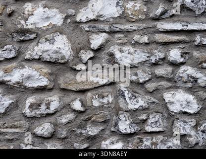 Traditional Stone Wall Close Up showing Natural whitewashed aging Stock Photo