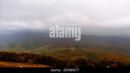 Rain clouds over an autumn mountain forest. Polish Bieszczady Mountains. Stock Photo