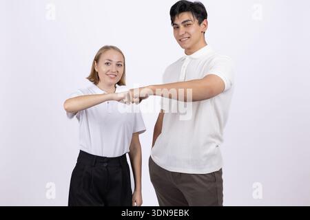 Young couple making heart shape with their hands Stock Photo