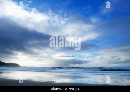 Stormy, winter skies over Porthtowan beach, Cornwall, UK Stock Photo