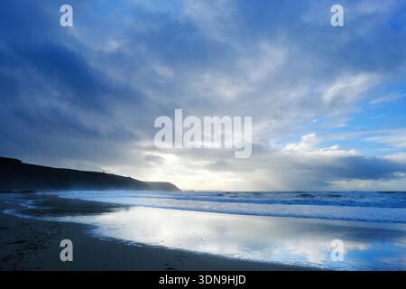 Stormy, winter skies over Porthtowan beach, Cornwall, UK Stock Photo